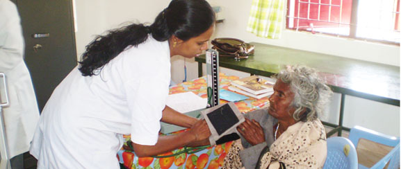 A SCAD nurse treating an elderly patient in Tamil Nadu 