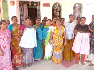 Ladies from a Women's savings group at SCADCharity train for a new income generating activity in sowing