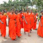 SCAD women going to meeting in their orange saris