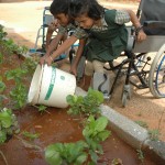 Children tending the garden at Anbu Illam